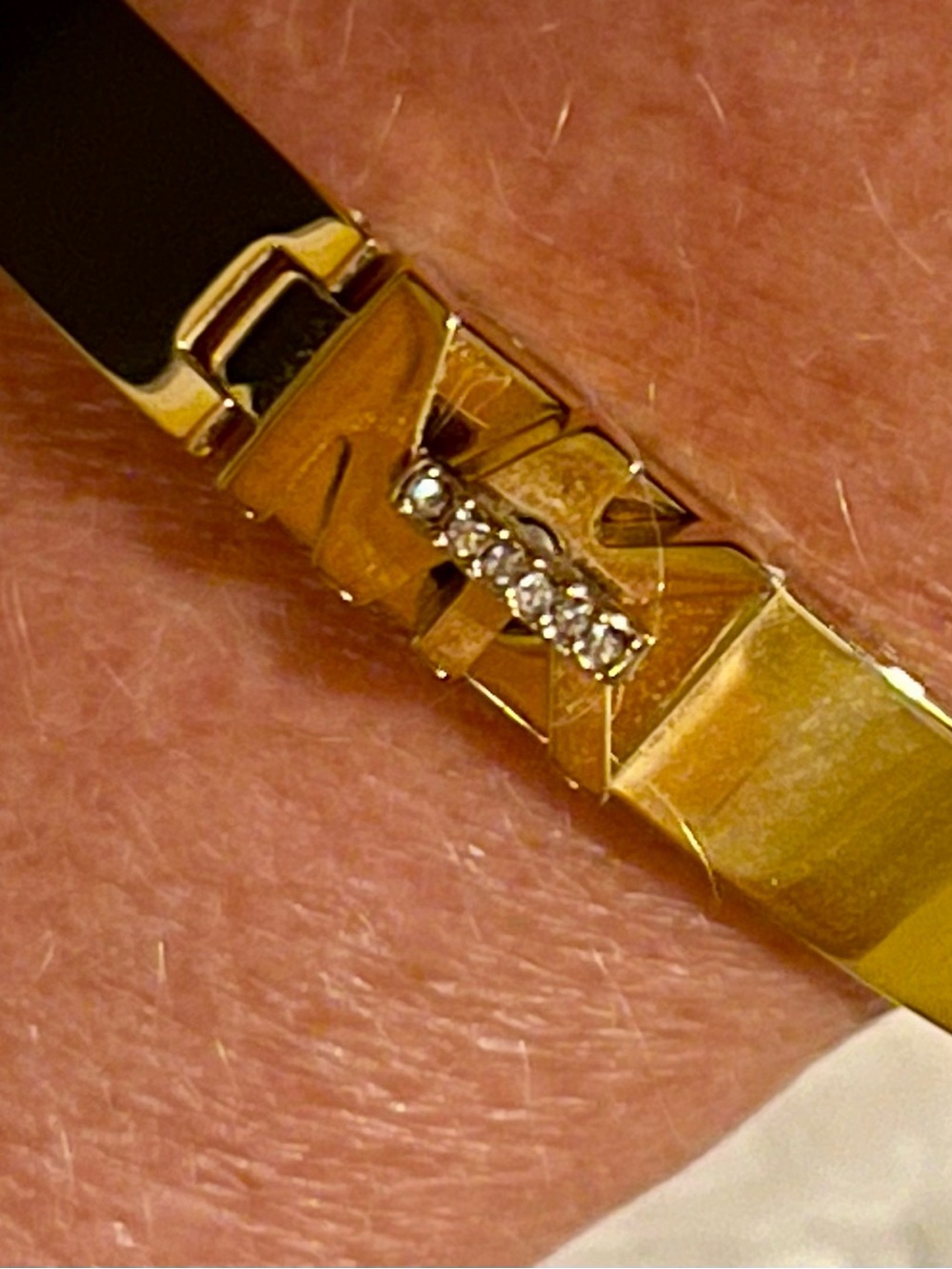 Michael Kors Gold Tone Logo Hinge Bracelet with Clear Crystals and Blue Accent